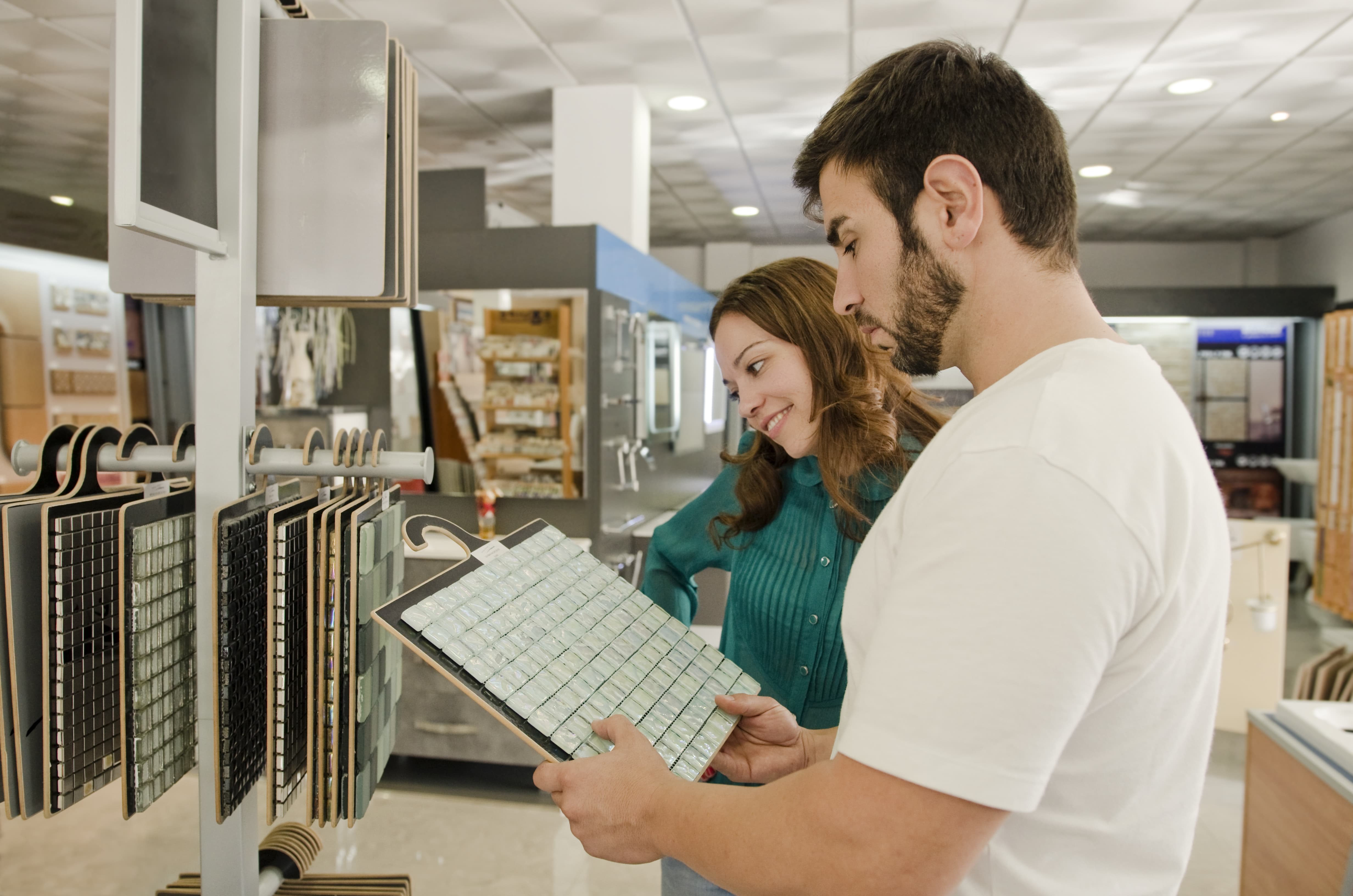 DIYers shopping the aisles at home improvement retailer