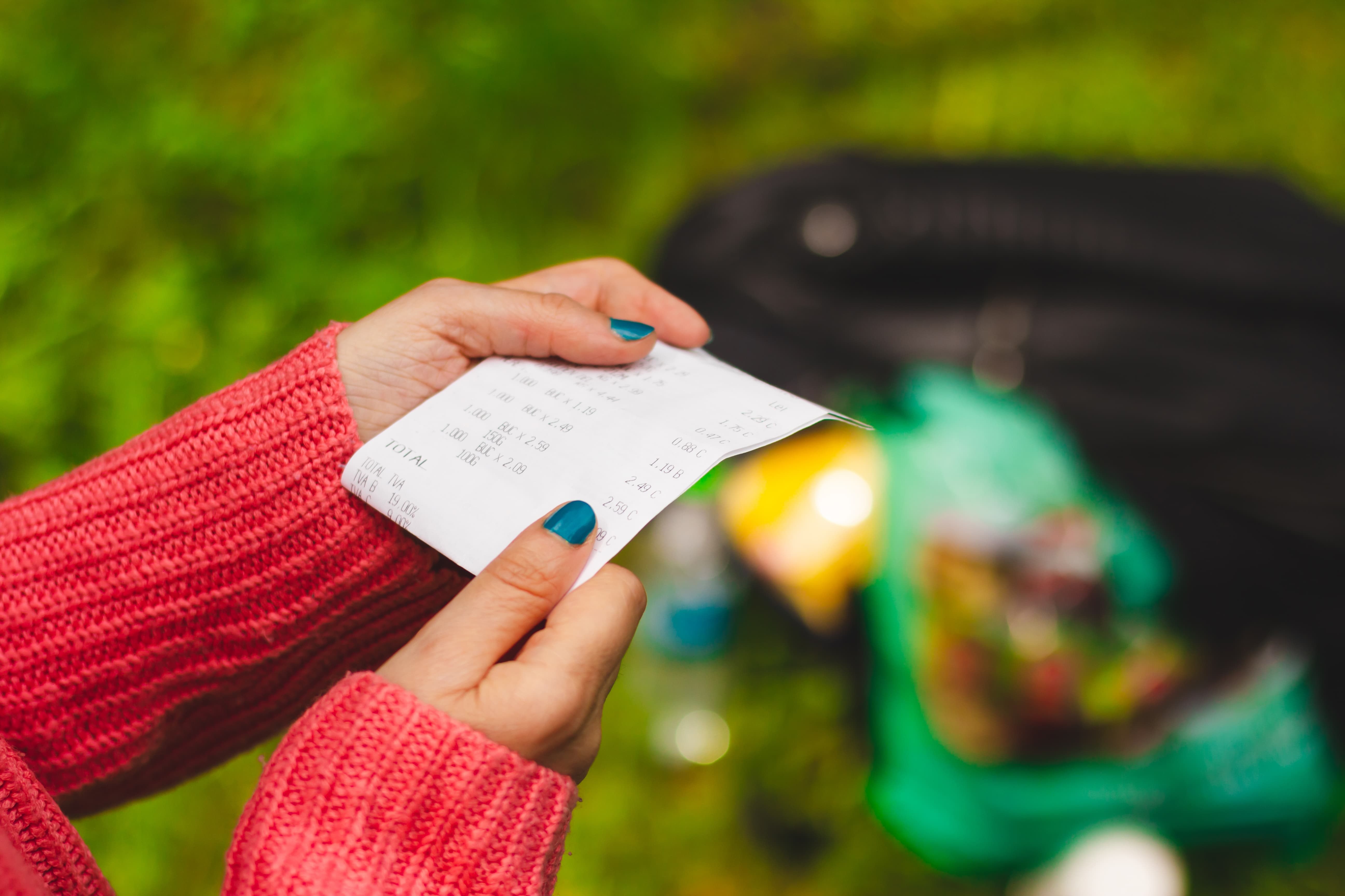 woman holding a receipt -pricing strategy is key to sell-through